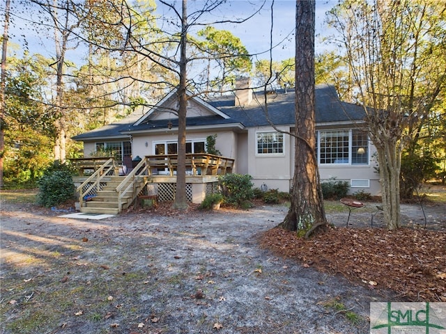 view of front of property featuring a wooden deck