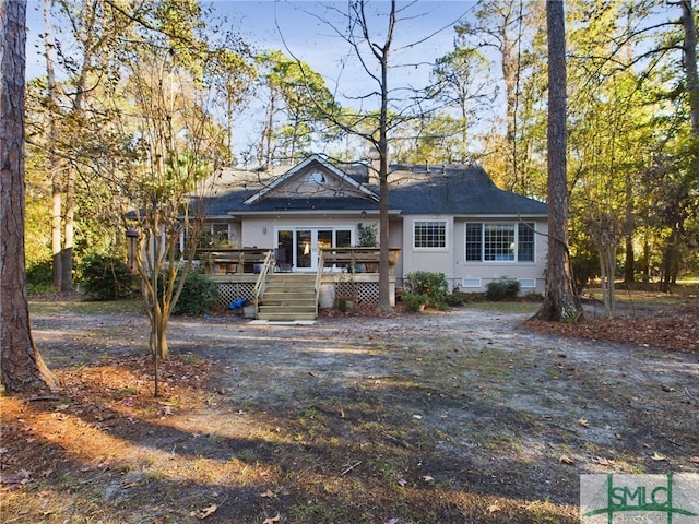 rear view of house with a deck