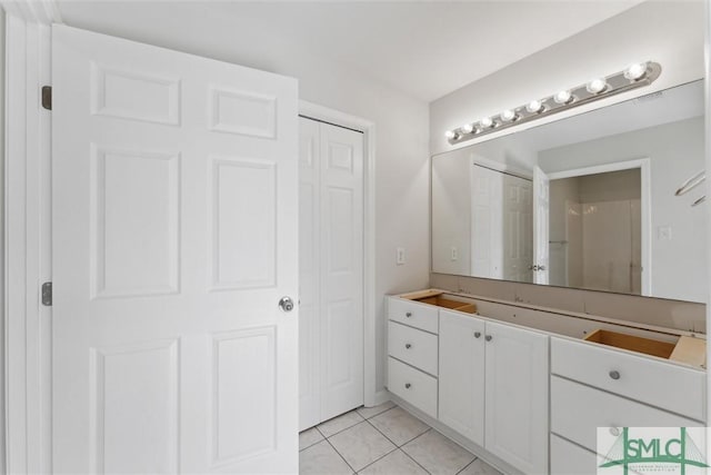 bathroom featuring tile patterned floors and vanity