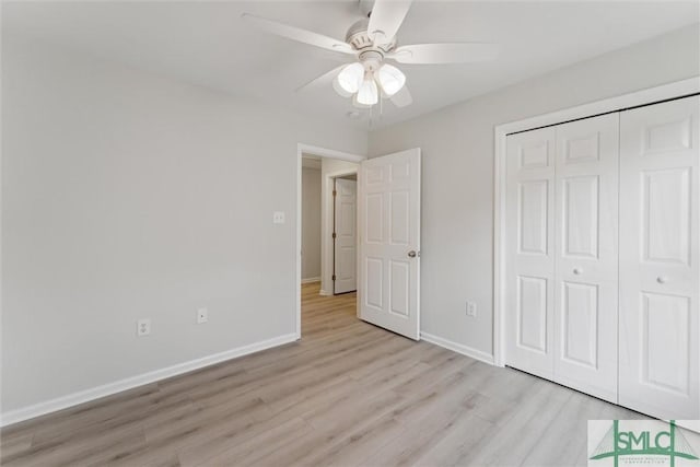 unfurnished bedroom featuring a closet, ceiling fan, and light wood-type flooring