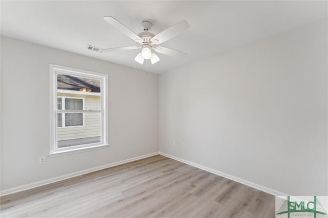 empty room with light wood-type flooring and ceiling fan