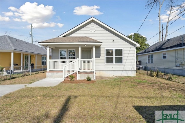 bungalow-style home with a front yard and a porch