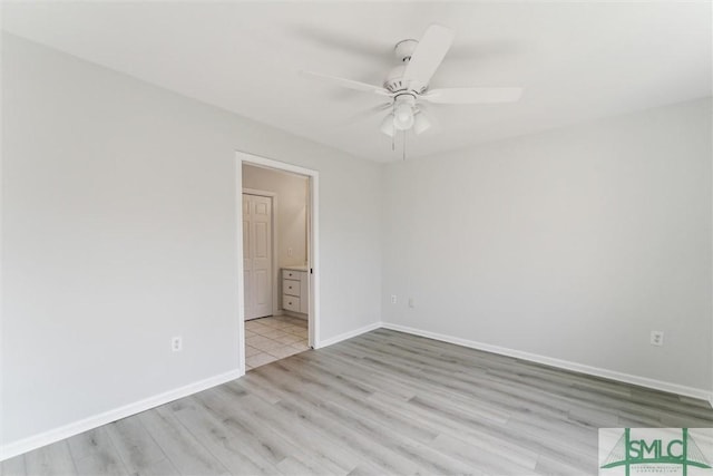 spare room with ceiling fan and light hardwood / wood-style flooring