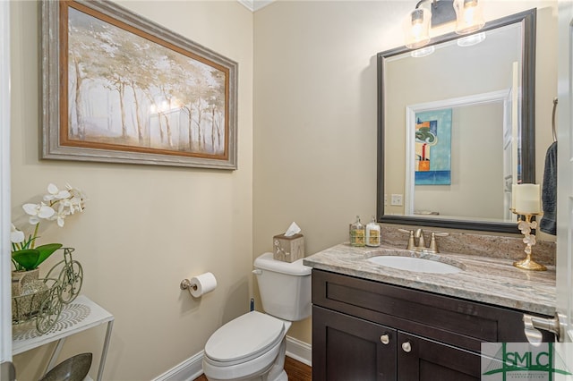 bathroom featuring toilet and vanity