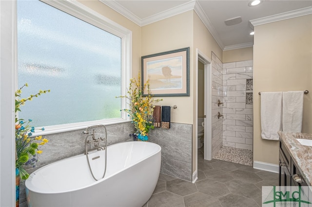 full bathroom featuring vanity, shower with separate bathtub, tile walls, toilet, and crown molding