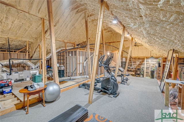 workout room with vaulted ceiling