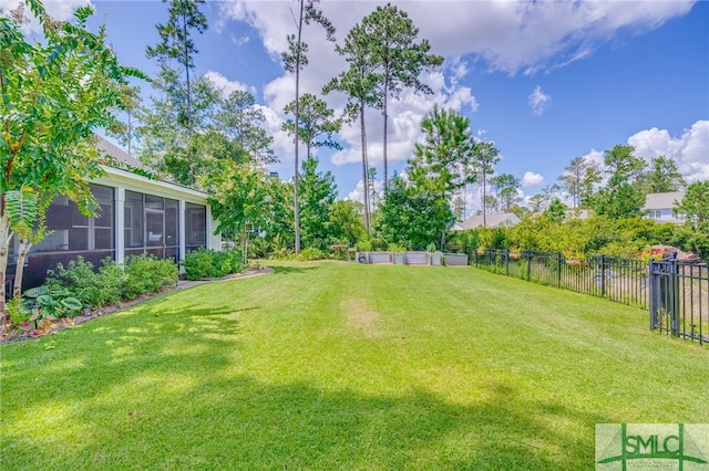 view of yard with an outdoor living space and a sunroom