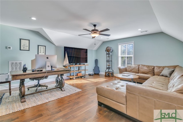 living room featuring vaulted ceiling, ceiling fan, and hardwood / wood-style flooring