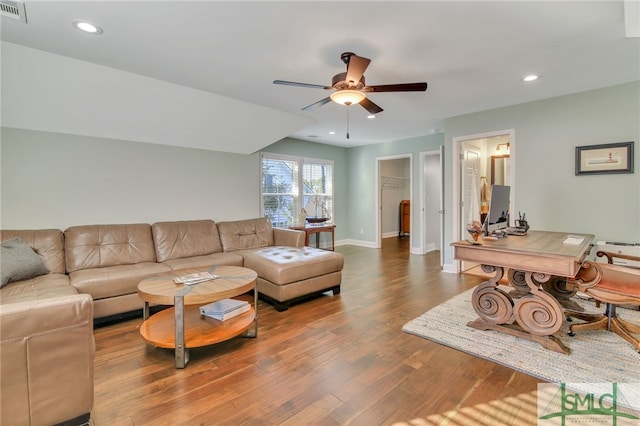 living room with ceiling fan and hardwood / wood-style flooring