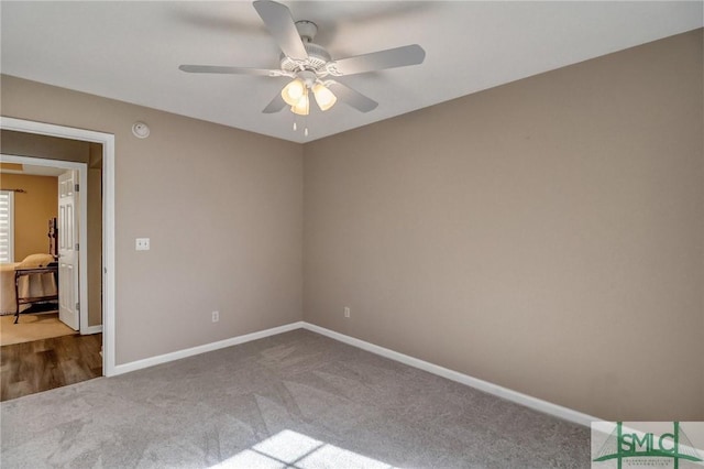 unfurnished room featuring ceiling fan and carpet flooring