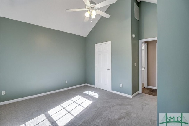 unfurnished bedroom with high vaulted ceiling, light carpet, and ceiling fan