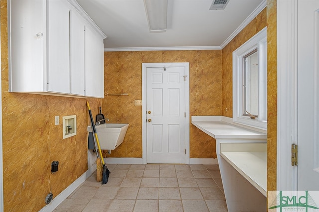 laundry room featuring cabinets, sink, ornamental molding, and hookup for a washing machine