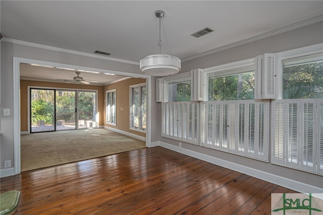 empty room with ceiling fan, wood-type flooring, and ornamental molding