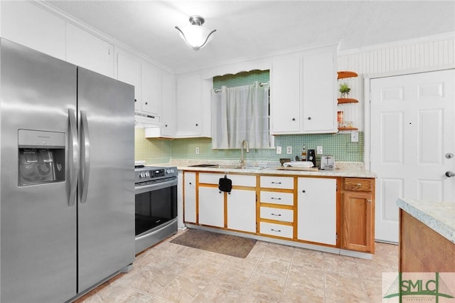 kitchen featuring tasteful backsplash, stainless steel appliances, and white cabinetry