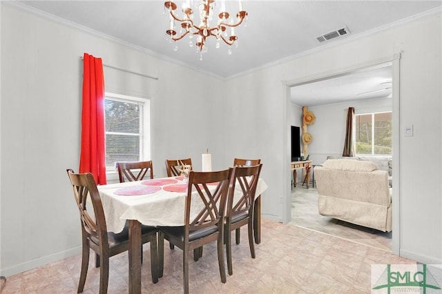 dining room with an inviting chandelier and crown molding