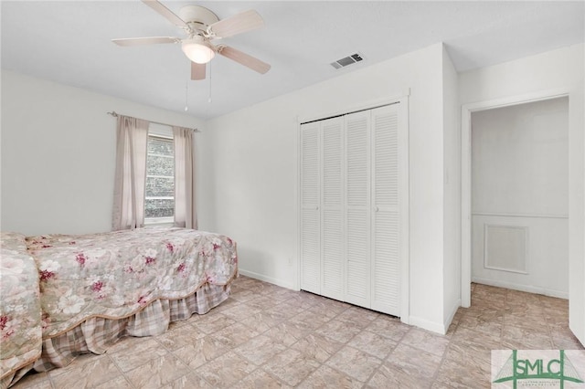 bedroom with ceiling fan and a closet