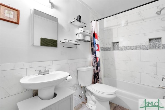 bathroom featuring tile walls, toilet, and shower / tub combo with curtain