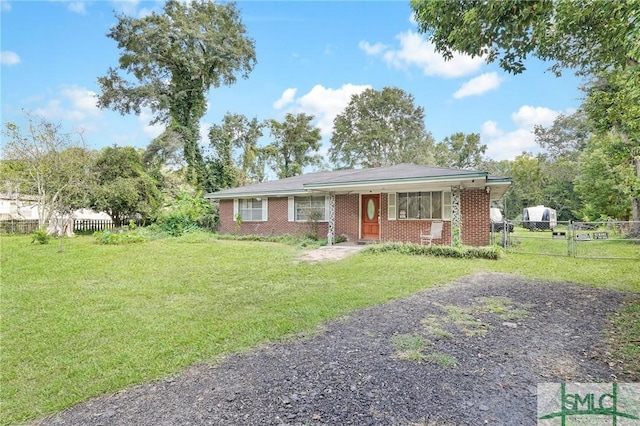 ranch-style home featuring a front yard