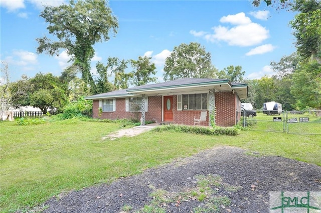 ranch-style house featuring a front lawn