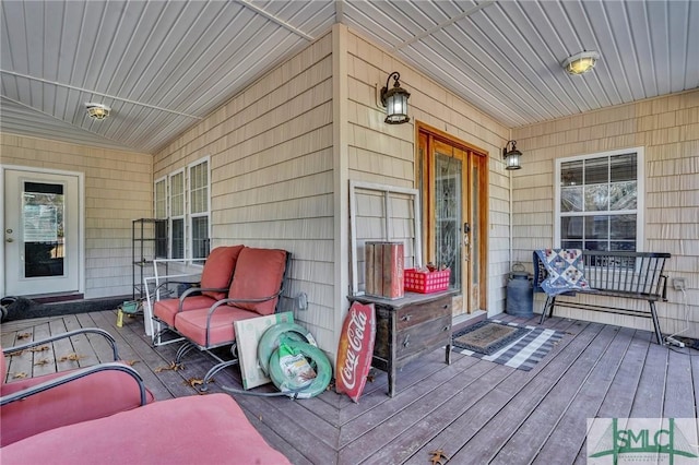 wooden terrace featuring a porch