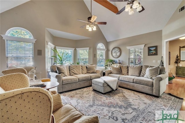 living room with high vaulted ceiling, wood-type flooring, and ceiling fan