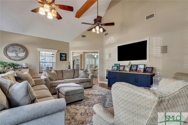 living room featuring high vaulted ceiling, beam ceiling, ceiling fan, and hardwood / wood-style flooring