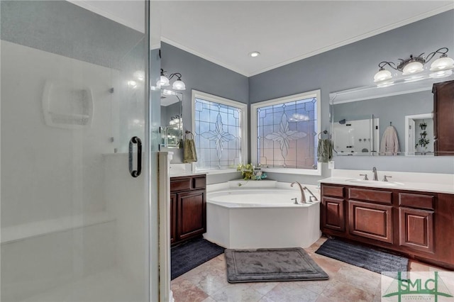 bathroom featuring crown molding, separate shower and tub, and vanity