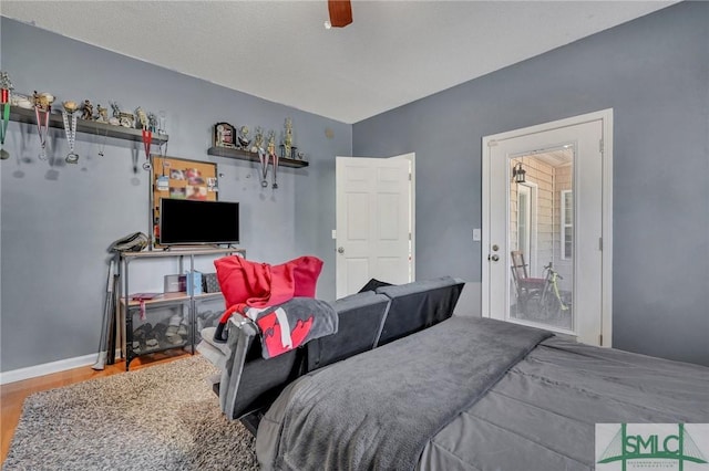 bedroom featuring ceiling fan and wood-type flooring