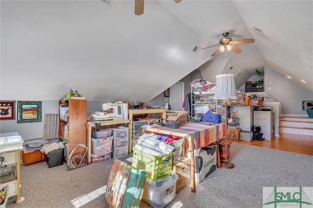 interior space featuring ceiling fan and vaulted ceiling