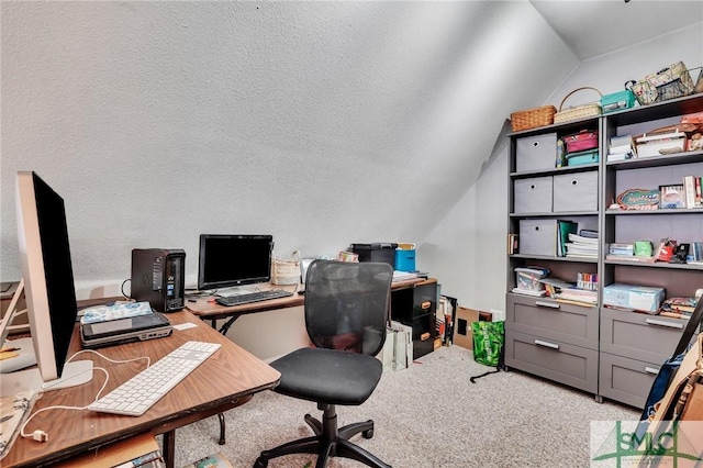 home office with light colored carpet, a textured ceiling, and vaulted ceiling