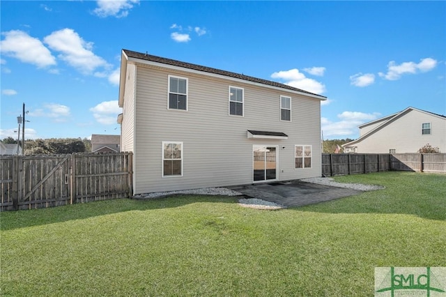 back of property with a lawn and a patio