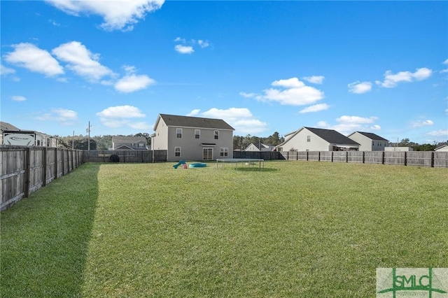 view of yard with a trampoline