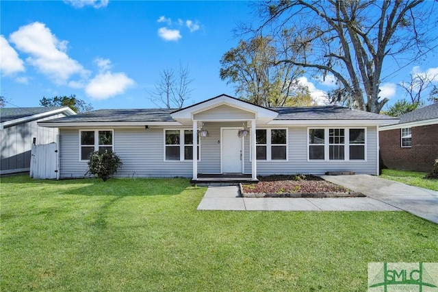 ranch-style home with a front lawn