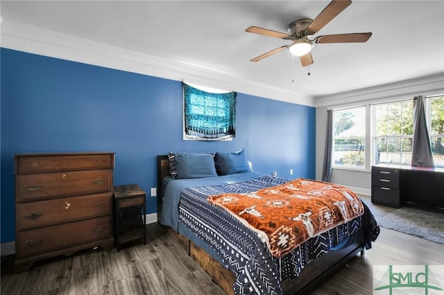 bedroom featuring ceiling fan, hardwood / wood-style flooring, and ornamental molding