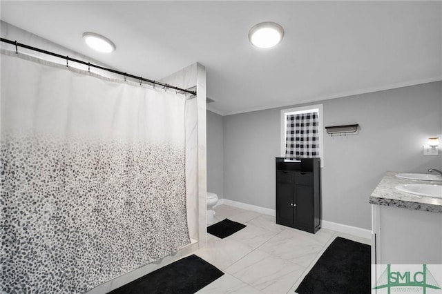 bathroom with toilet, vanity, and a shower with curtain