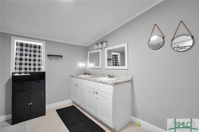 bathroom featuring lofted ceiling and vanity