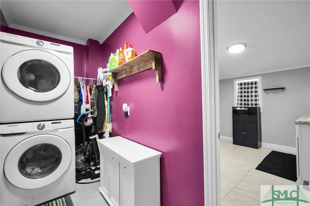 washroom featuring stacked washing maching and dryer and ornamental molding