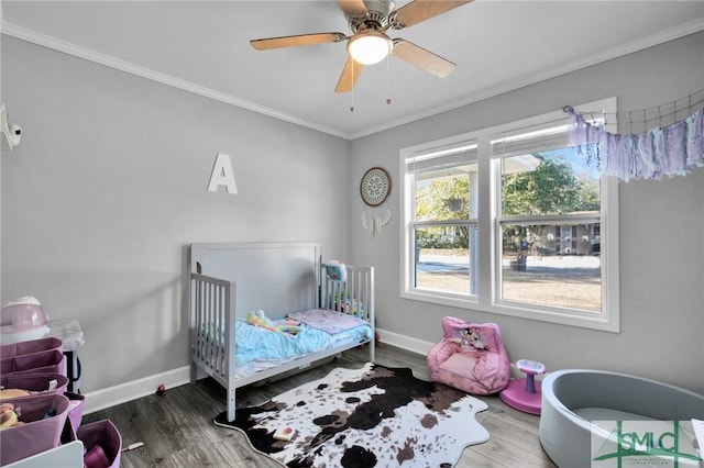 bedroom with ceiling fan, ornamental molding, and hardwood / wood-style flooring