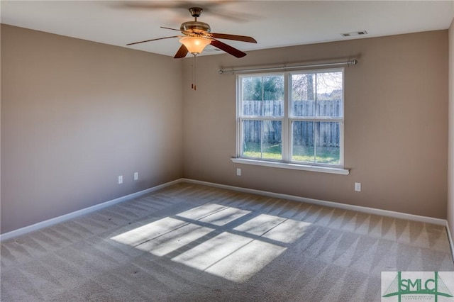 carpeted empty room with ceiling fan