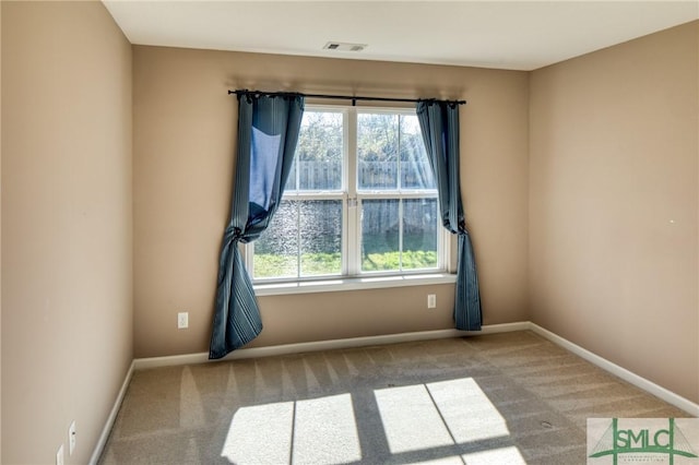 empty room with light colored carpet