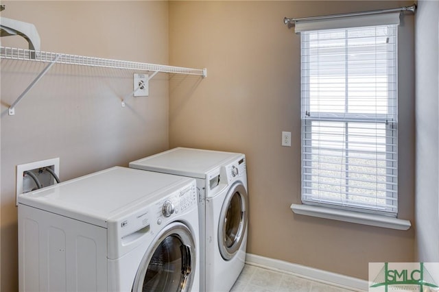 clothes washing area featuring independent washer and dryer