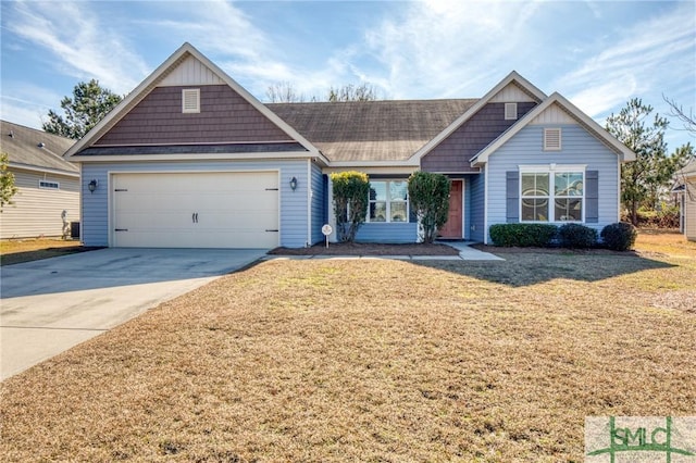 view of front facade with a garage and a front yard