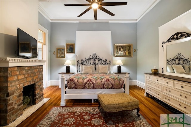 bedroom featuring ceiling fan, dark wood-type flooring, and ornamental molding