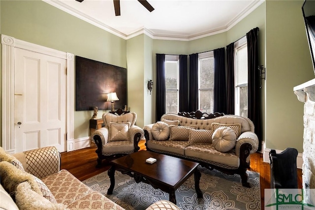 living room with ceiling fan, wood-type flooring, and crown molding