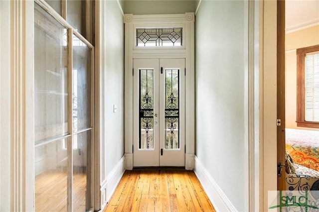 doorway featuring light wood-type flooring and french doors