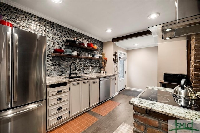 kitchen featuring dark hardwood / wood-style floors, sink, crown molding, stainless steel appliances, and light stone counters