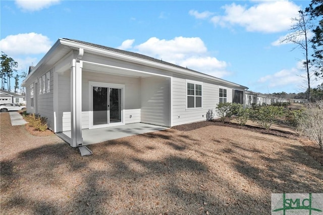 back of property with a patio area