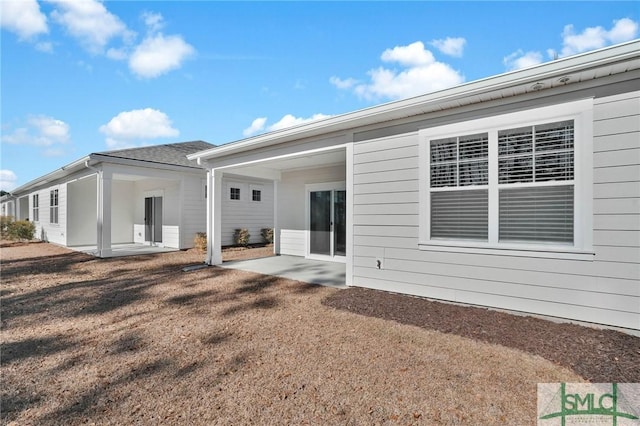 rear view of property featuring a patio