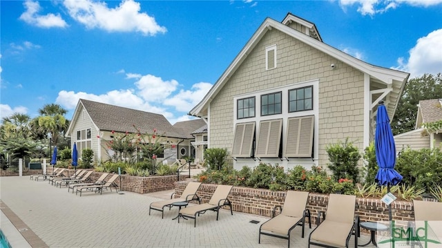 back of property featuring a patio area