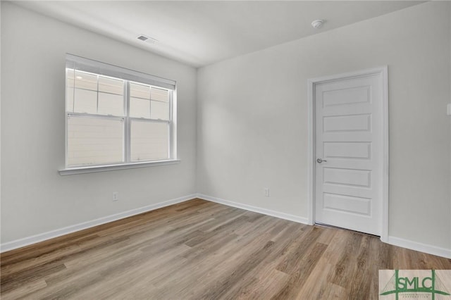 unfurnished room featuring light hardwood / wood-style flooring